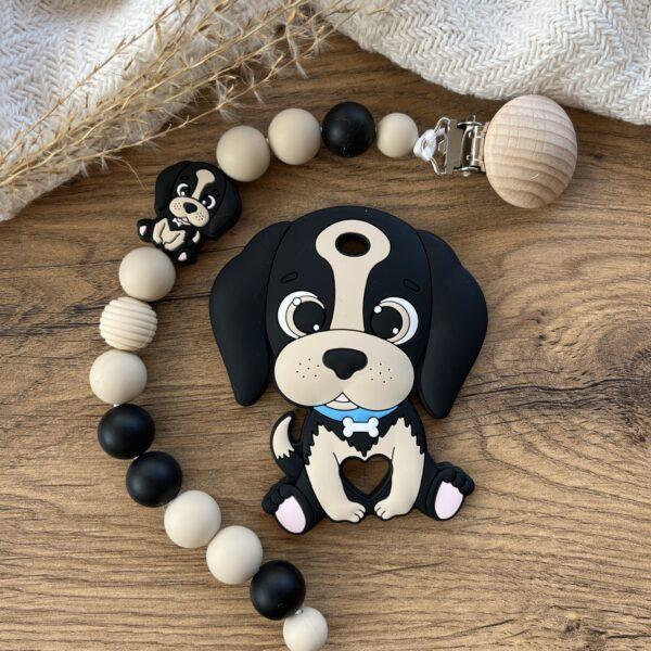 Fekete kutya cumilánc rágókával